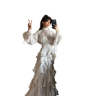 Woman in a white vintage dress taking a mirror selfie on a transparent background