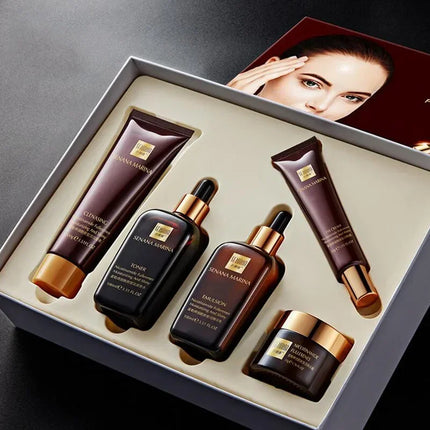 Set of skincare products in a box with a woman's face in the background