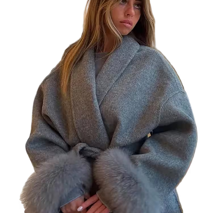 Woman wearing a gray coat with fur trim on a transparent background