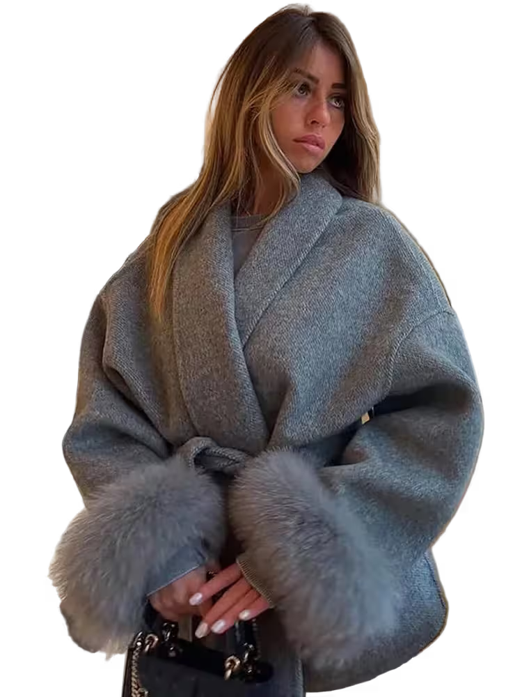 Woman wearing a gray coat with fur trim on a transparent background