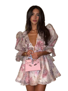 Woman in a floral dress holding a pink handbag on a transparent background
