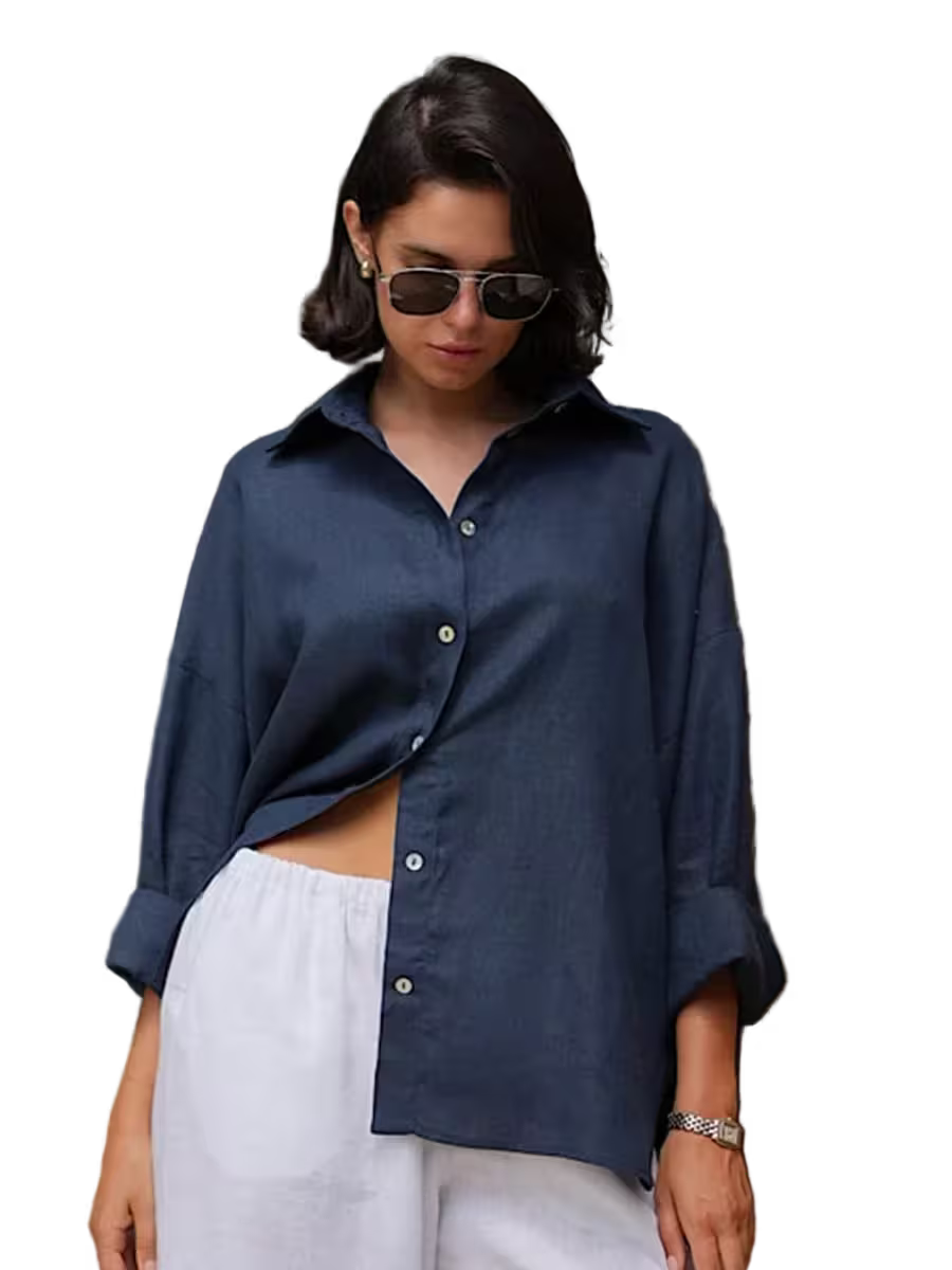 Woman wearing a navy blue shirt and white pants with sunglasses on a transparent background