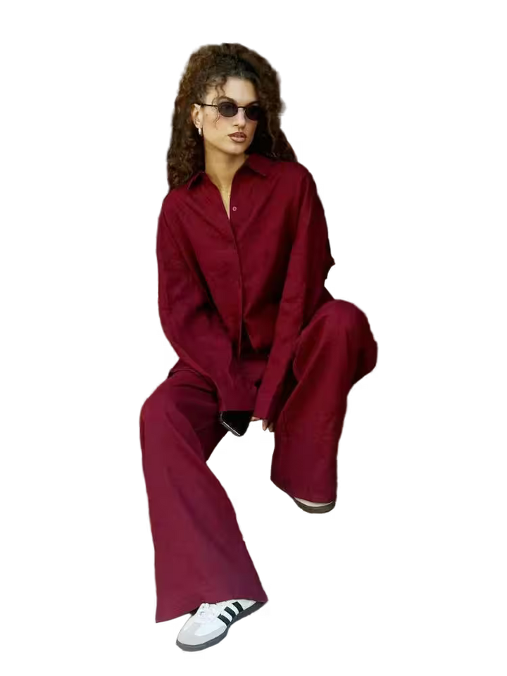 Person wearing a red outfit with white sneakers on a transparent background
