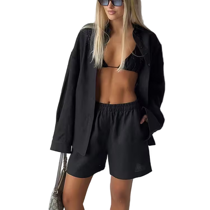 Woman in black outfit with sunglasses on a white background