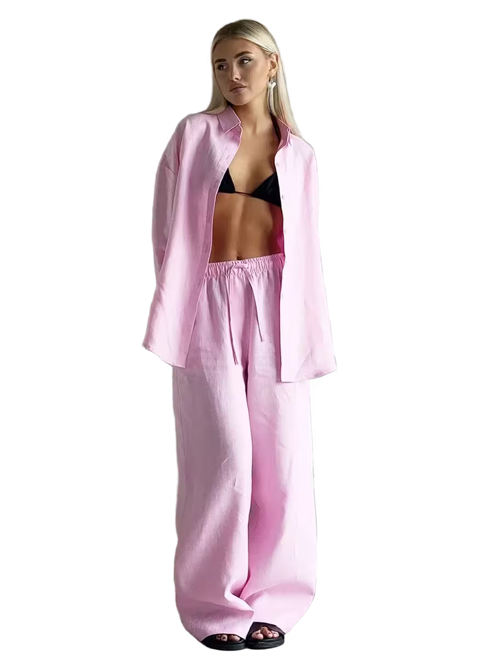 Woman wearing a pink outfit with a black bra and panties on a transparent background
