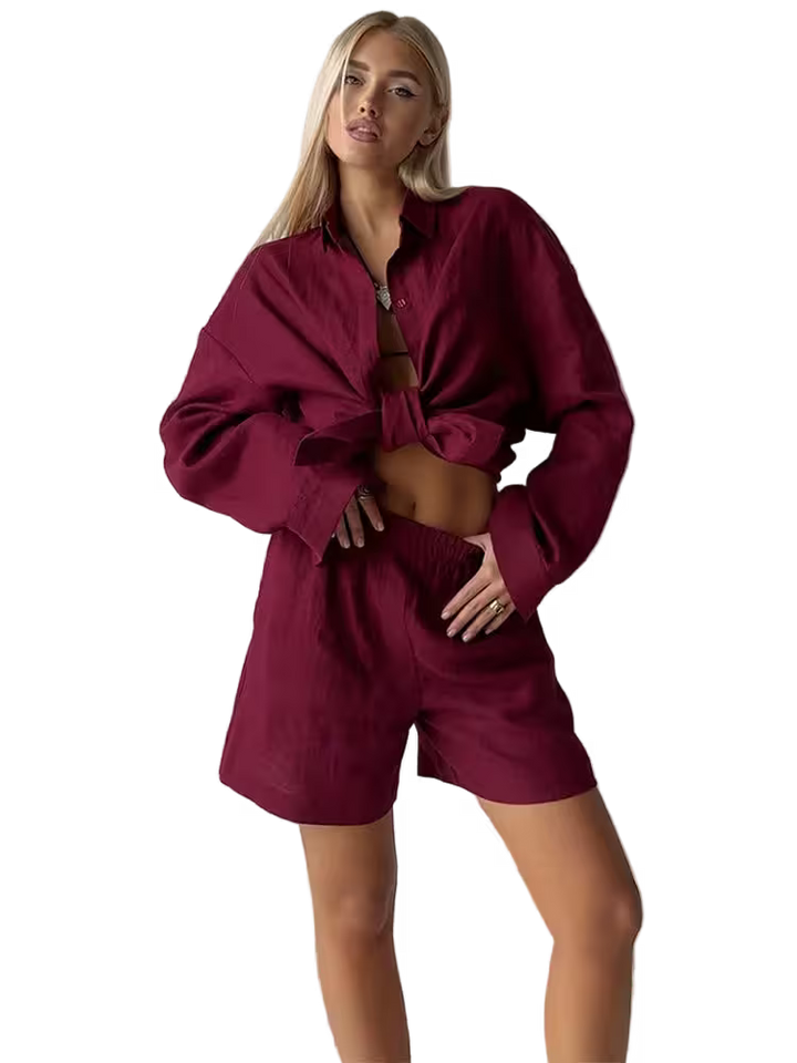 Woman wearing a burgundy outfit with a matching shirt and shorts on a transparent background