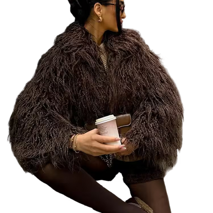 Woman in a brown fur coat holding a coffee cup on a white background