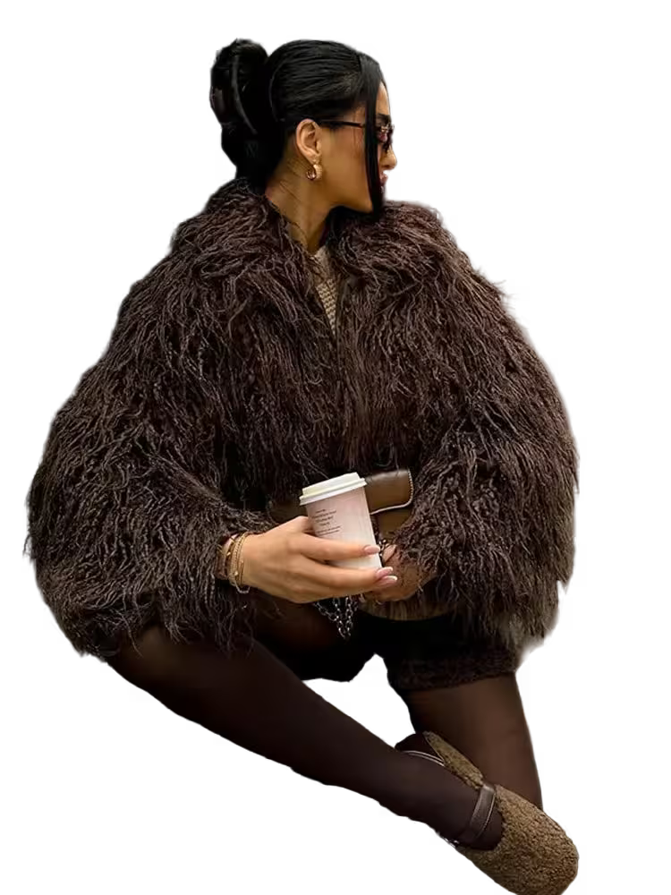 Woman in a brown fur coat holding a coffee cup on a white background