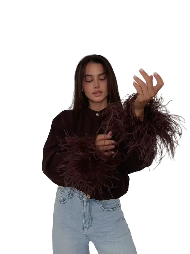 Woman wearing a brown textured sweater and light blue jeans on a transparent background