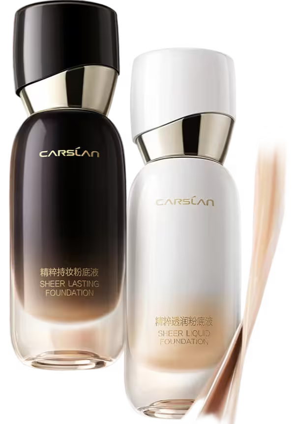 Two bottles of CarSLan foundation with a brush on a white background