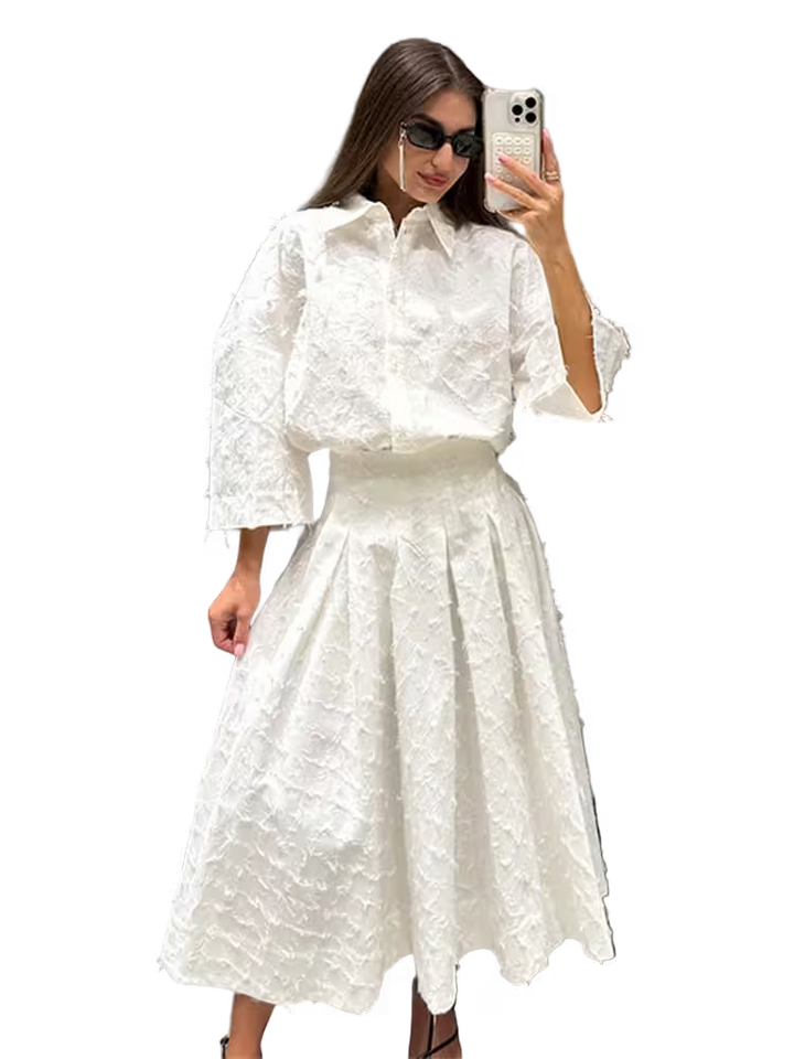 Woman wearing a white textured outfit taking a selfie on a transparent background