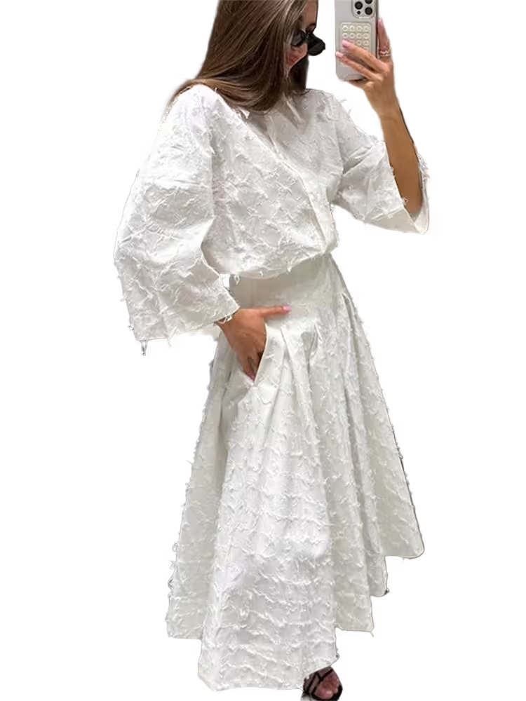 Woman wearing a white dress with puffed sleeves, standing against a transparent background.