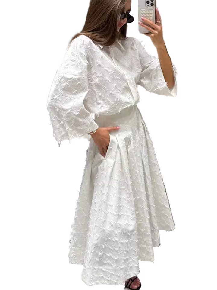 Woman wearing a white dress with puffed sleeves, standing against a transparent background.