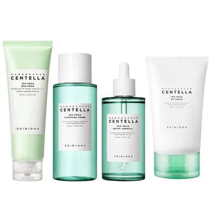 Set of skincare products from SKIN1004 with green and white packaging on a white background
