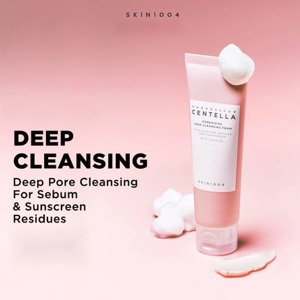 SKIN1004 cleansing foam with cotton pads on a pink background
