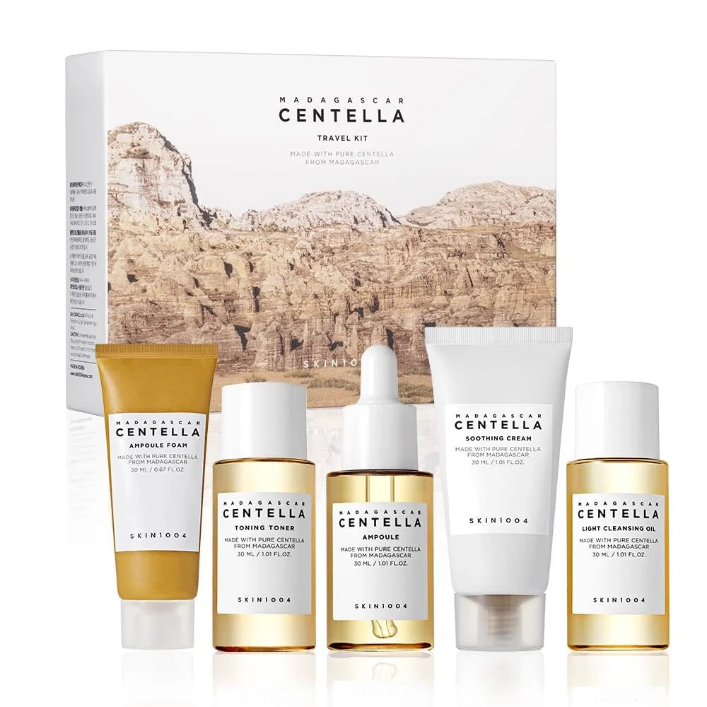 Skincare travel kit with bottles and packaging featuring 'Madagascar Centella' on a white background.