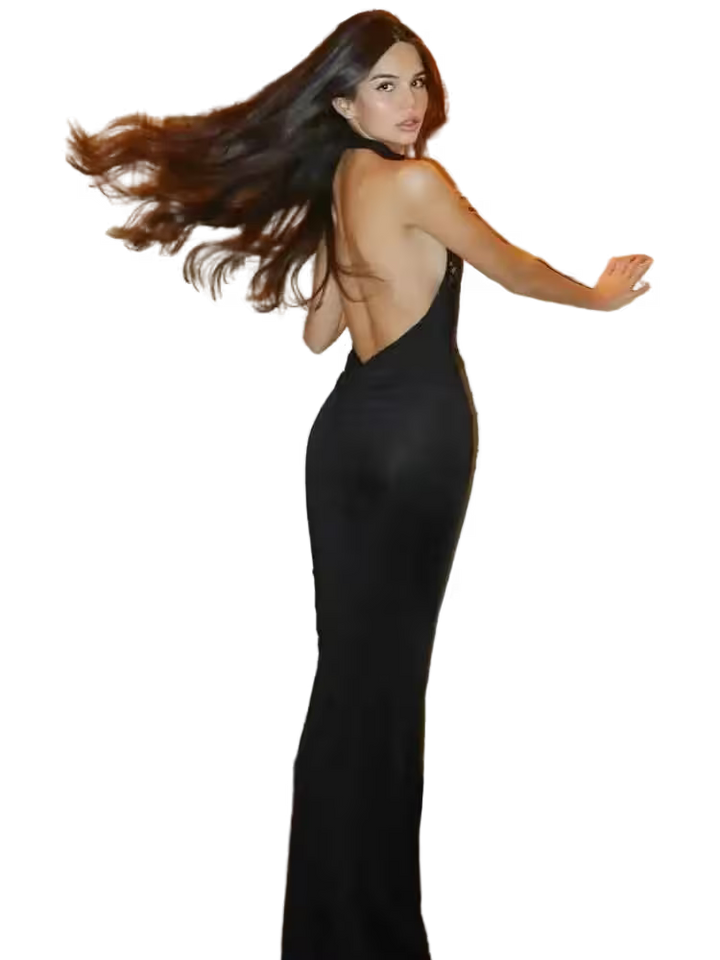 Woman in a black dress with flowing hair on a transparent background