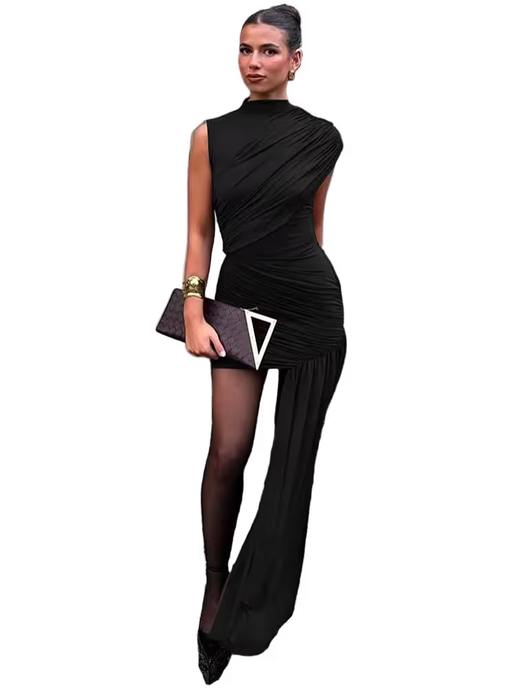 Woman wearing a black dress with a geometric design on a white background