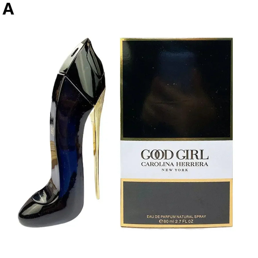 Black high-heeled shoe and Carolina Herrera 'Good Girl' perfume box on a white background