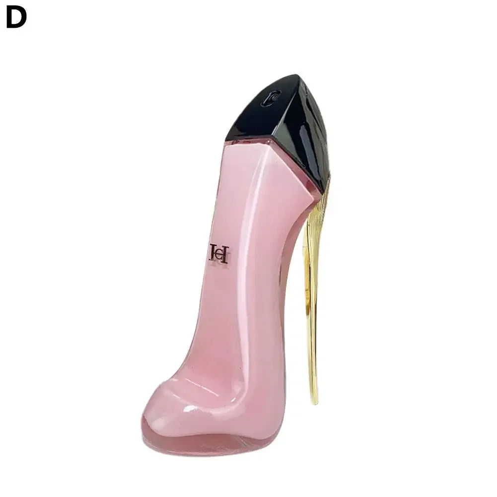 Pink high-heeled shoe with gold heel on a white background
