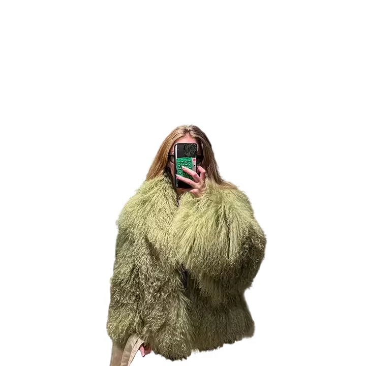 Person wearing a fluffy green coat against a white background