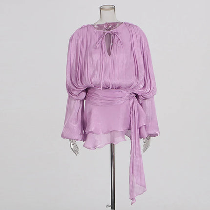 Lavender dress on a mannequin against a plain background