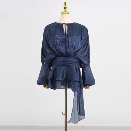 Blue dress on a mannequin against a white background