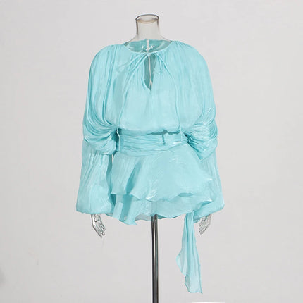 Light blue blouse on a mannequin against a plain background