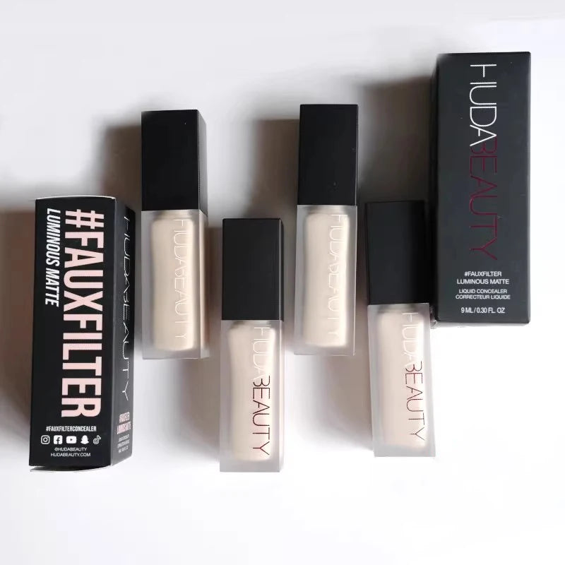Huda Beauty liquid concealer with packaging on a white background