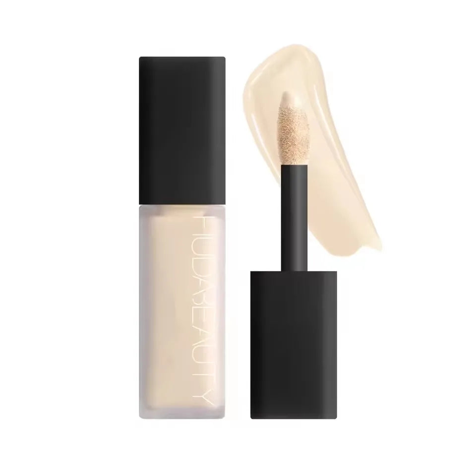 Cosmetic concealer with applicator on a white background