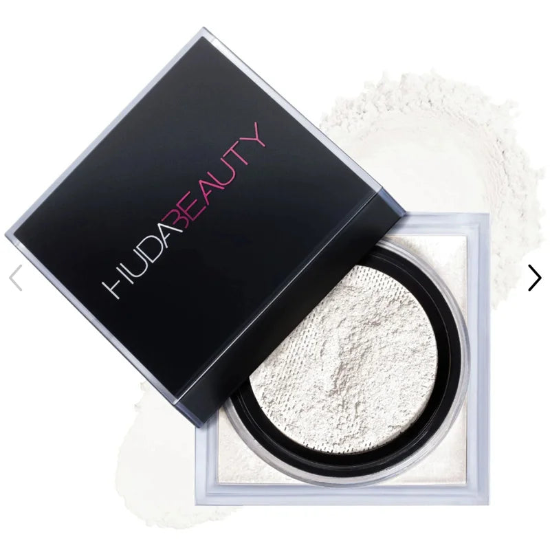 Huda Beauty powder with open case on a white background