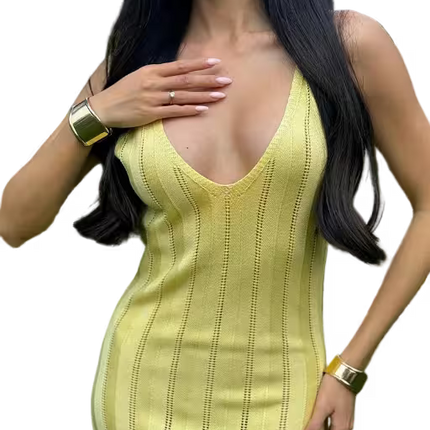 Woman wearing a yellow dress with a plain background