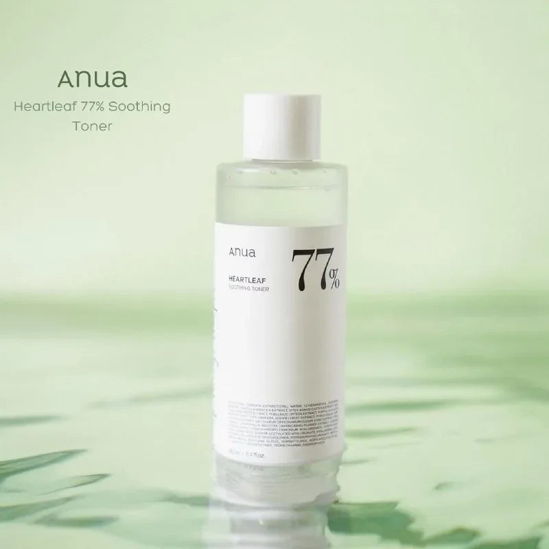Anua Heartleaf 77% Soothing Toner bottle on a green background