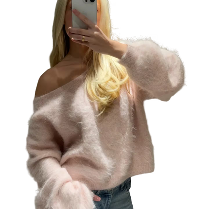 Person wearing a light pink sweater and blue jeans, holding a phone with a transparent background