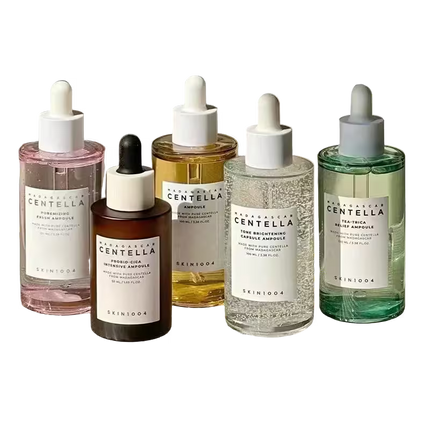 Five Skinfood Centella Ampoule bottles in various colors on a white background