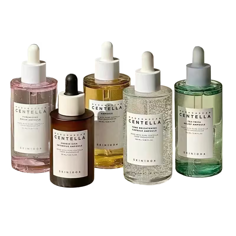Five Skinfood Centella Ampoule bottles in various colors on a white background