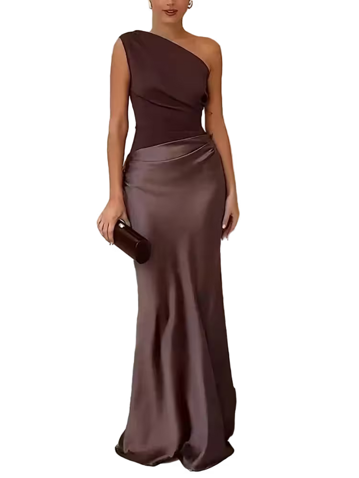Woman wearing a one-shoulder brown evening gown on a white background