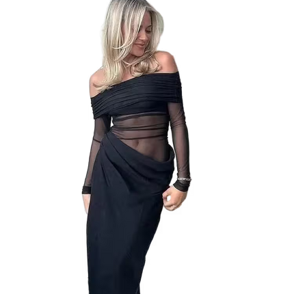 Woman wearing a black off-shoulder dress with sheer panels on a white background