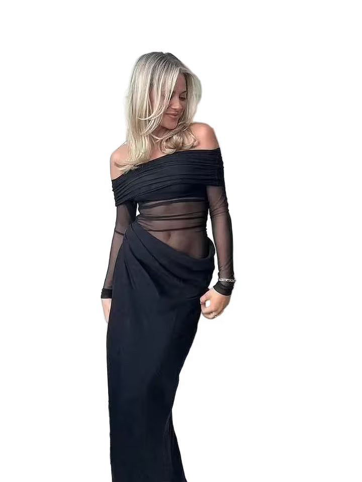 Woman wearing a black off-shoulder dress with sheer panels on a white background
