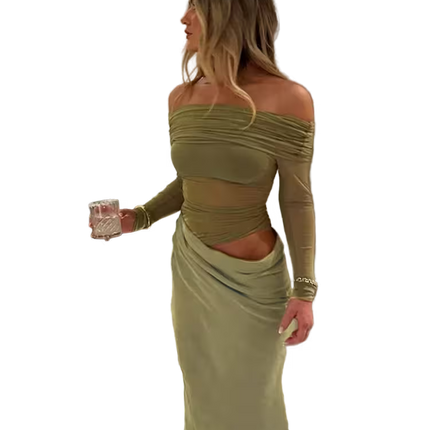 Woman in a green off-shoulder dress holding a glass on a transparent background