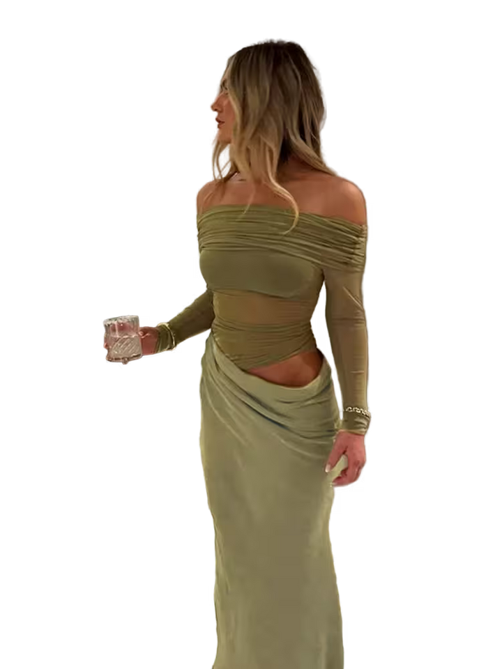Woman in a green off-shoulder dress holding a glass on a transparent background