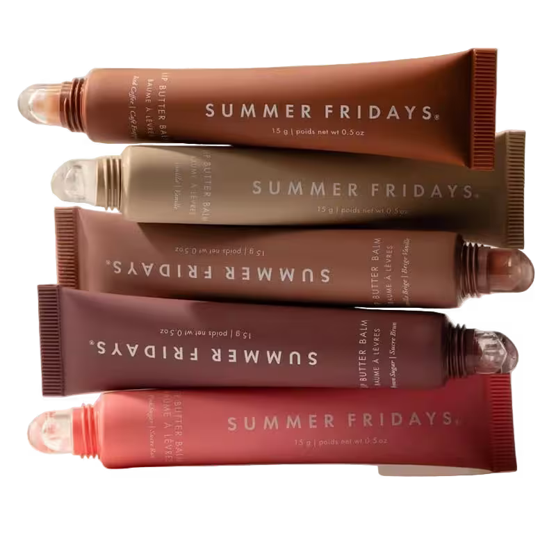 Stack of Summer Fridays butter balm tubes in various shades on a white background