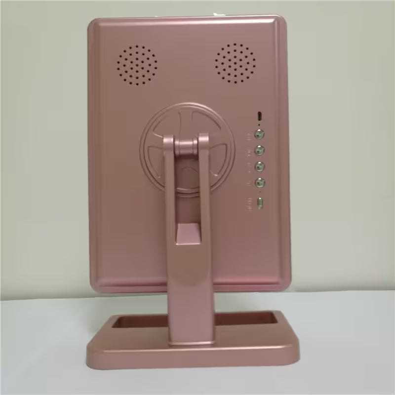 Pink electronic device with a stand on a light gray background