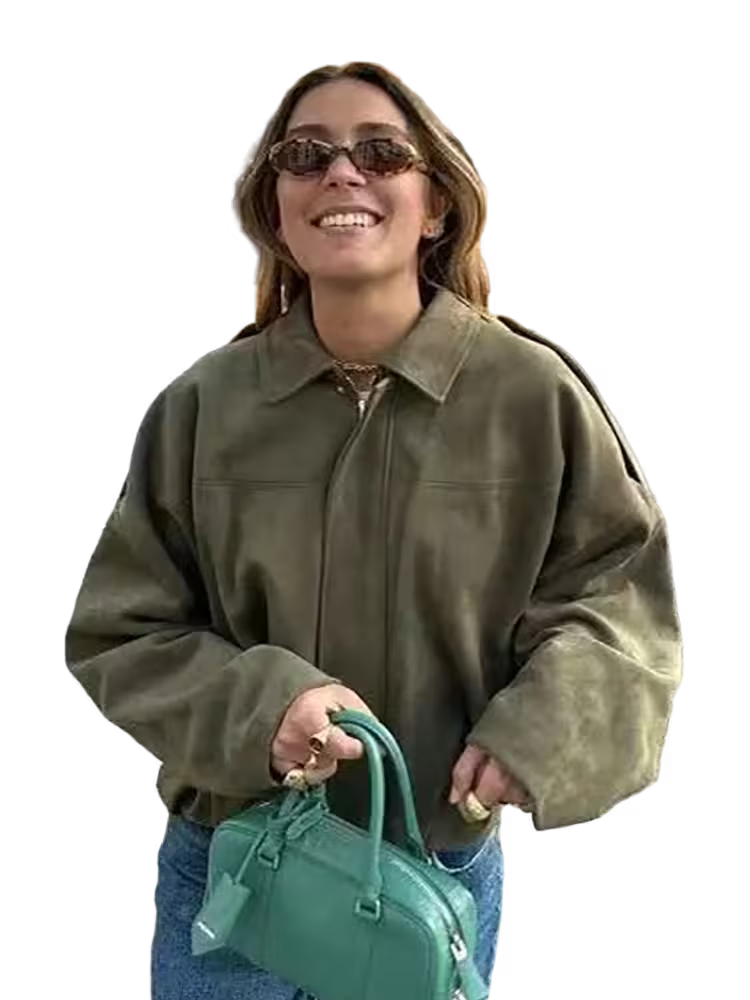 Woman wearing a green jacket and sunglasses, holding a green handbag on a transparent background