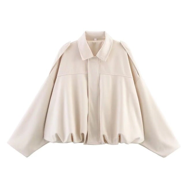 Beige cape-style jacket on a white background